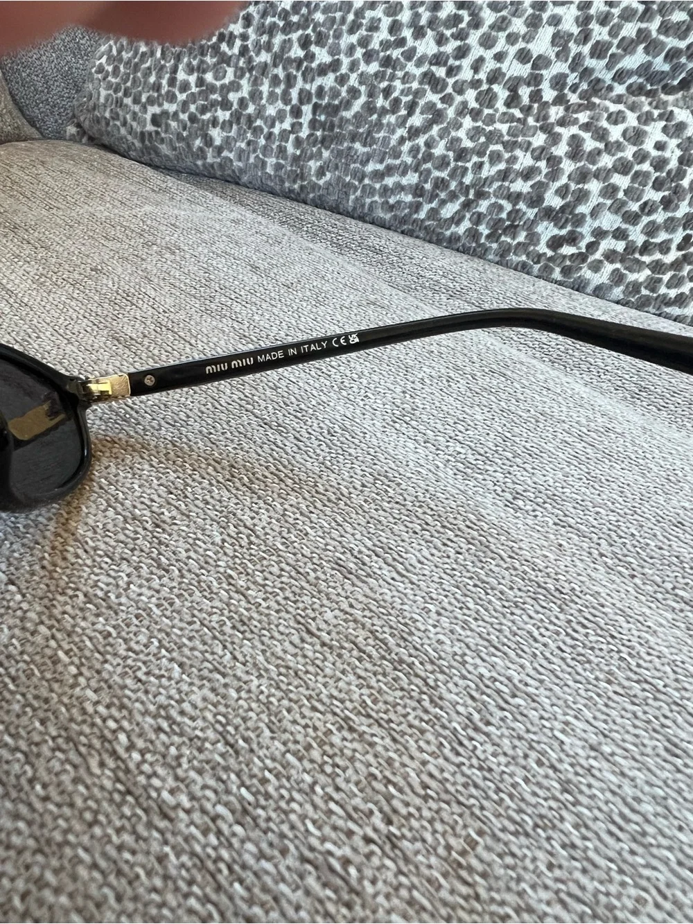 Miu Miu Black Sunglasses with Gold Accent - Classic Cat-Eye Style